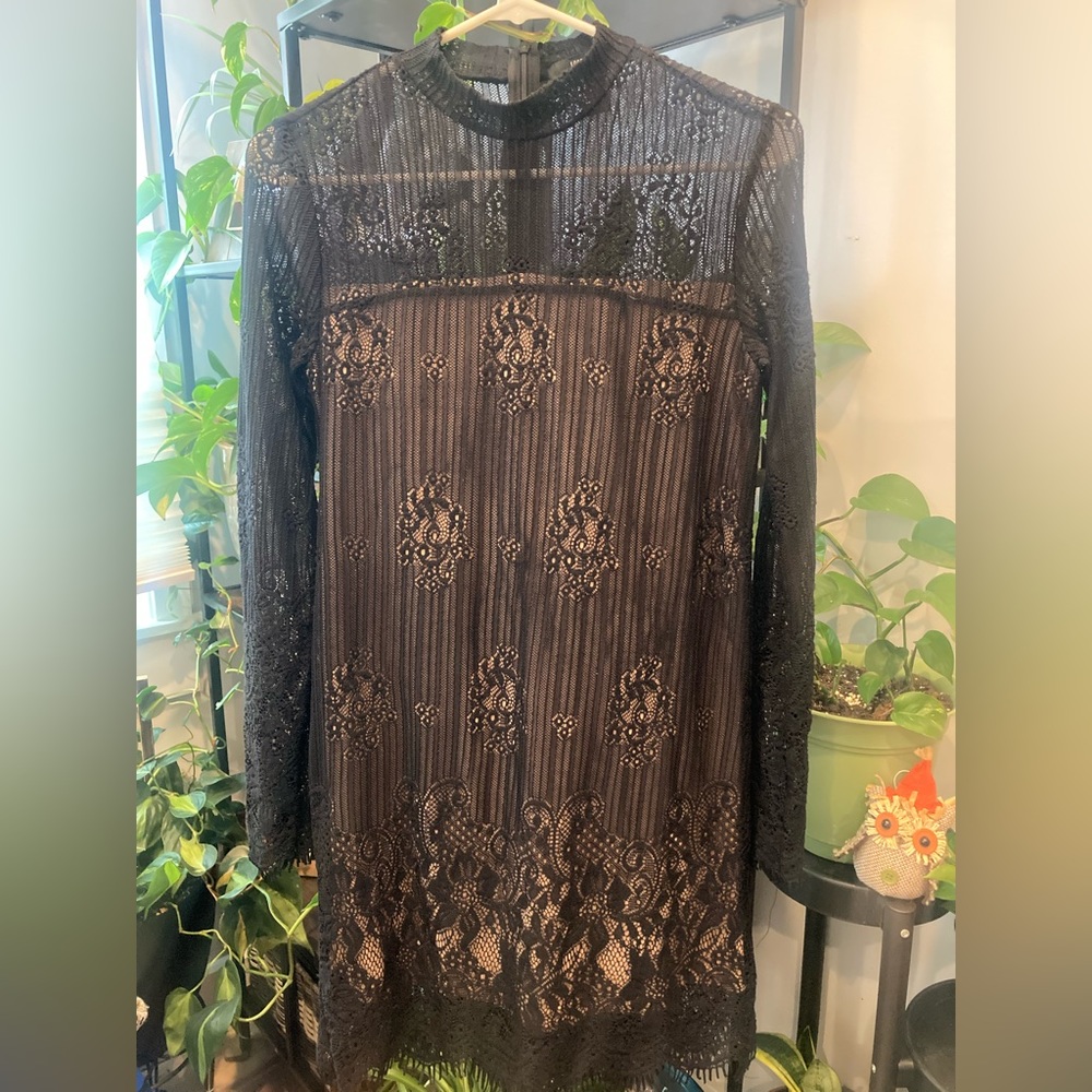 Lace like dress. Worn once. Body fitting with nude undertone